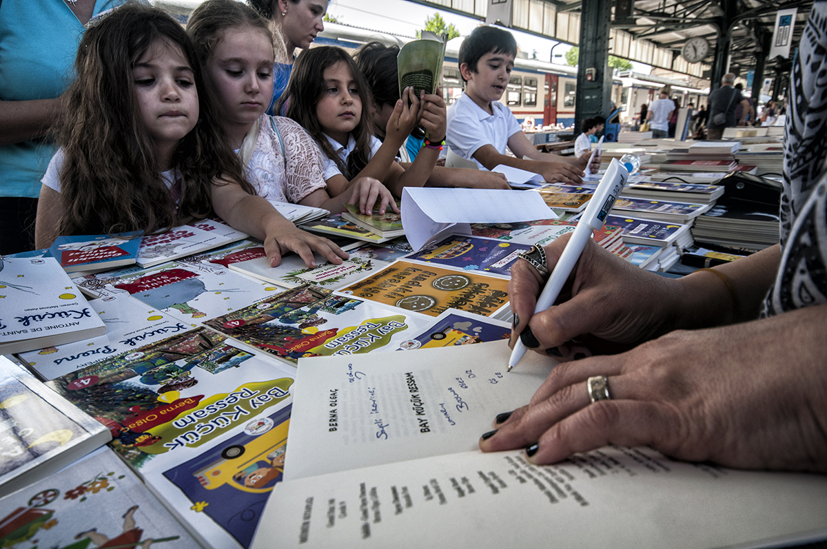 #154 —Kadıköy - 
Haydarpaşa Train Terminal hosts a book fair.
