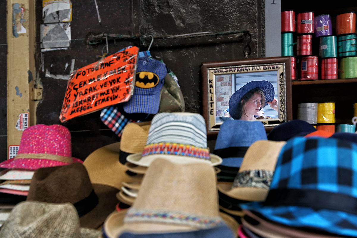 #168 —Tahtakale - 
A colourful hat shop.  
